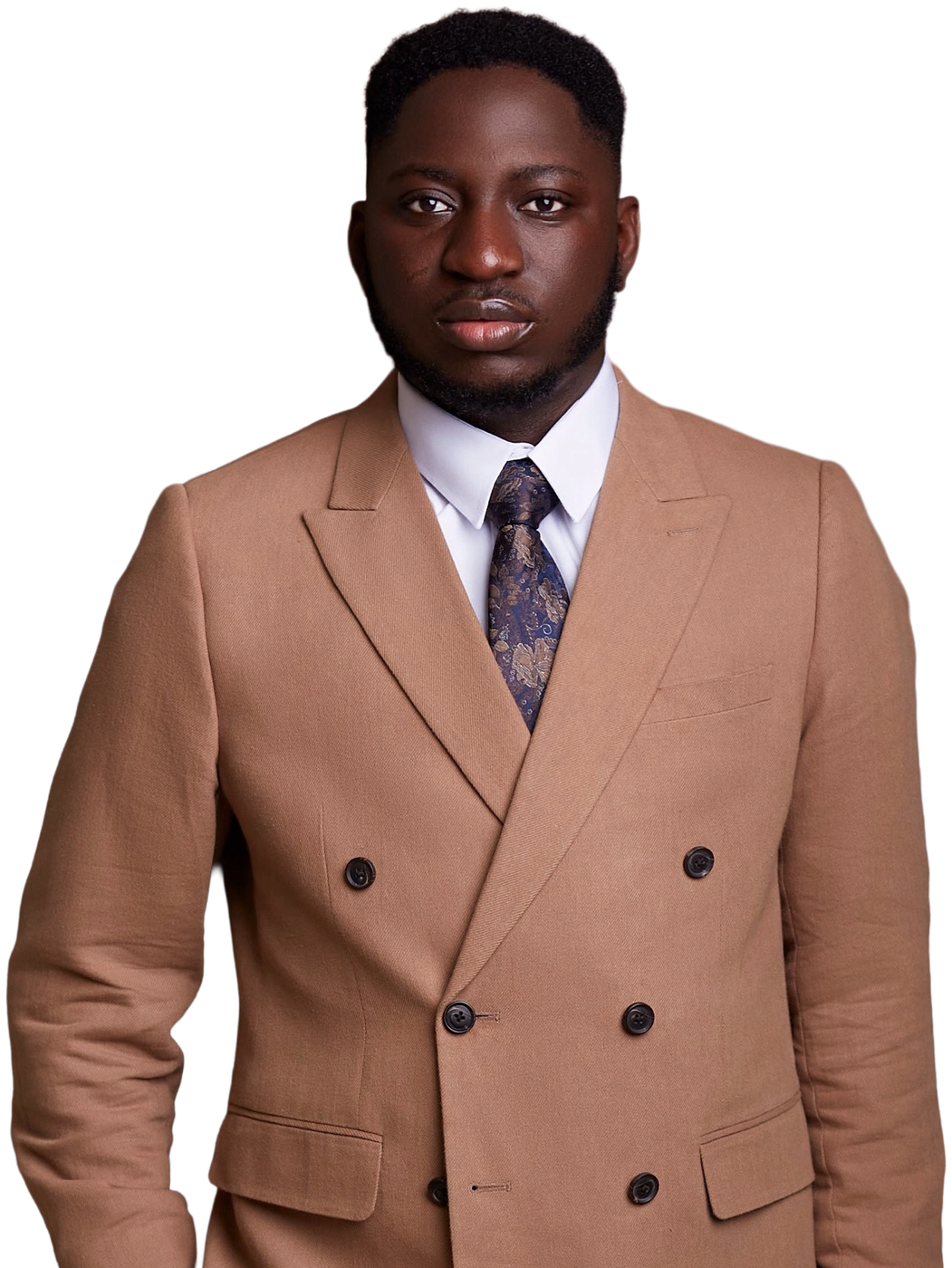 Michael Akintayo in a tan double-breasted suit